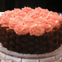 Pink Roses And Chocolate Buttercream Basketweave. I made this cake for my own birthday . I wanted a pretty cake and wanted to practice my basketweave technique and roses. I think it turned...