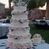 Amanda The bride wanted lots of bling and peacock feathers. Cake is all dummies, in 18, 16, 14, 12, &10" layers covered in ivory fondant...