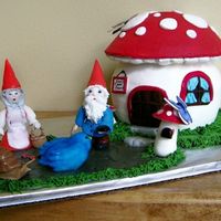 Gnomes At Home I made this for my mother's birthday. The mushroom house is a white cake with alternating layers of raspberry and bavarian cream...