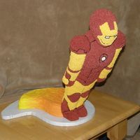 Iron Man Iron Man is done with rice crispies and covered in buttercream. The base is cake.