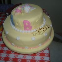 Baby Place A baby shower cake in fondat with a little girl and a girafe
