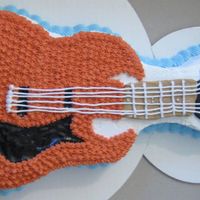 Another Guitar Cake Unfortunatly i was in a SUPER hurry with this cake because I had to plan an entire surprise party way off in the middle of nowhere, and try...