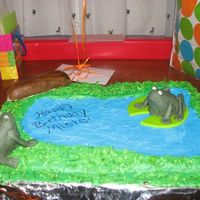Img_0003.jpg Frog cake I made for my daughter birthday, frogs and logs were hand molded from rice krispie treats then covered in icing and fondant, this...