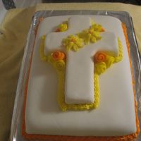 Img_0037.jpg cross covered fondant cake, this is only my 2nd time using fondant, and my first time using it to completely cover a cake.