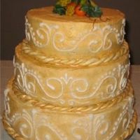 Golden Delight This was a white cake with B/C frosting that I brushed with gold powder liquified with vodka. It had fruit filling to go with the fruit...