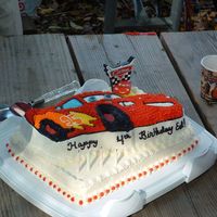 Cars Cake This was a cake I made for a four year olds birthday ! He loved the cake... used the wilton cars pan. Bottom layer is butter cake with IMBC...