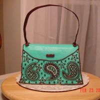 Purse Cake #2 This is DH Devil's Food with the Extender recipe added plus 1/4 cup of Dutch Processed Cocoa. All buttercream frosting with a ribbon...