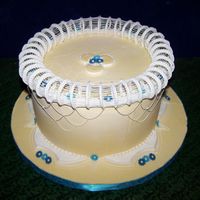 Lambeth Stringwork Cake RI iced, with RI curls, stringwork in tip 0, flowers centerpiece is run sugar and flowers are GP.