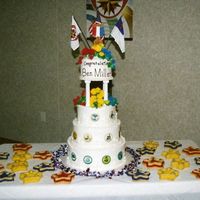 Gold Medal Acheivement (Gma) Teired cake with gumpaste flowers (first time for me). On sides of cake are rice paper images of all the other awards the Ranger received....