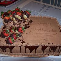 100_0224.jpg this is my attempt at a mans cake ,i made this for my husband for fathers day ,its buttercream icing with strawberries and pineapples