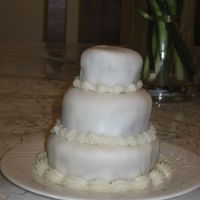 Mini Anniversary Cakes One of three mini cakes that I attempted. The smaller the cake the harder it is! Chocolate cake with buttercream and then fondant. I had a...