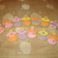 Little Girls NFSC with fondant details. I couldn't get the face right- so I left them faceless!