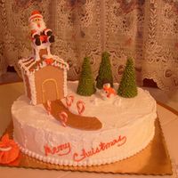 Santa Left His Bag Lemon cake with buttercream icing. House and pathway are made with gumpaste and royal icing, trees are sugar cones with royal icing, Santa...
