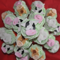 Farm Animal Cupcakes cupcakes with fondant farm animal faces! buttercream icing underneath.