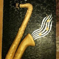 Saxaphone This was a tenor sax. Had to do another small cake to go along with it, not enough cake! It was actually a life size replica on a huge...