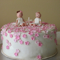 Greek Orthodox Baptism This cake was for two little sisters who were baptized. Figures and flowers are gum paste. Covered in Mmf.