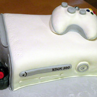Gamers Delight! This is an XBox cake made with vanilla cake and vanilla buttercream. Covered and decorated in MMF. This is probably my favorite cake so far...