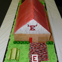 Our Boathouse This cake was so fun to make! It is the boathouse that my kids and I row out of. Gum paste sides, shrubberies, picnic table, bricks, food...