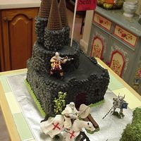 Castle Cake Castle cake for my neighbors son. Had so much fun making it! Just kept trying to add on. It is all buttercream with plastic figurines. The...