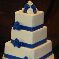 Indigo Blue Buttercream Cake all buttercream cakes, 4", 6" and 8 " ribbon and flowers are fondant.
