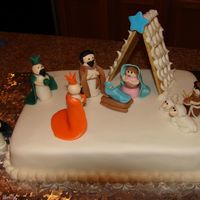 Nativity Scene Used 9 X 13 cake, all the figures are hand sculpted the barn is made of graham crackers