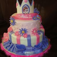 Fancy Nancy Tiered Cake All the decorations are fondant, the crown I used gumpaste I had to make it two days in advance to get it to stand correctly.