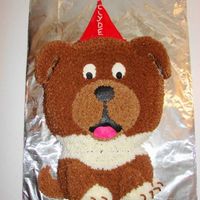 Doggie Birthday Cake Cake for our 12 year old dog's birthday :-) Modified from a cake in the 2008 Wilton Yearbook. I have to say that I HATE drop stars!