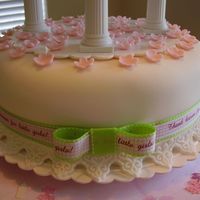 Bottom Tier Baby Shower Another shot of bottom tier of cake. Pink flowers are fondant that I sprinkled for decoration. Bottom is triple chocolate fudge with...
