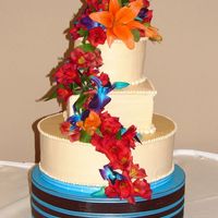 My 1St Wedding Cake! My very first wedding cake, for a former coworker. Each tier is spicy chocolate cake with chocolate mousse and white chocolate cinnamon...