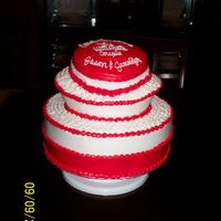 100_0290.jpg 3tier white all bc icing. Couple met while playing ultimate frisbee, making the top look like a frisbee is all I could come up with. Was...
