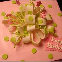 Birthday Present Cake Buttercream with Gumpaste Bow (First attempt at making bow) and fondant dots.