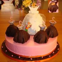 Bridal Shower Cake Bridal shower cake. All cakes are carrot with whipped cream cheese filling. Fondant covered dresses and gum paste hangers and accents....