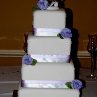 Lavander Wedding Very simple design, lavender and silver. Gumpaste roses made with the help of my friend Patrice {aka Serenatea}.