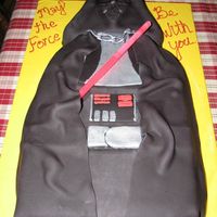 Darthvader the body is cake and the head is krispy treat all covered in fondant. light sword is a glow stick. I had fun doing it and learned alot but...