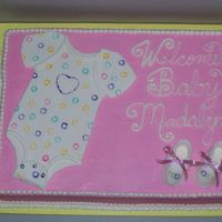 Welcome Baby Madalyn covered in bc with fondant onsie and fondant/gumpaste booties (this was my first time doing the booties and onsie and i had so much fun...