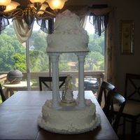 Sarah's Wedding Cake This cake looked much better in person. I did cornelli lace on top and sides of cake and had pastel pink roses.