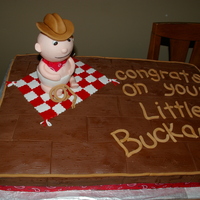 Cowboy Baby Shower 1/2 sheet cake for baby shower, half vanilla with raspberry filling 1/2 chocolate with chocolate mousse filling. This was a lot of fun to...