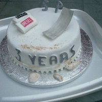 Shaun And Pauls Anniversary chocolate cake, chocolate fudge filling, covered with sugarpaste, - towels made also from sugarpaste, the "deckchair"is made from...