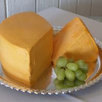 Groom's "cheesecake" The groom's favorite cake is cheesecake so the bride thought a gag cheese cake would be appropriate. The cake is a marble cake with...