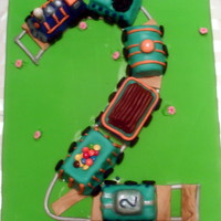 Choo-Choo Train I made this for my little boy who loves trains and has turned two. Train cars are cake covered in mmf with mmf accents and large sheet cake...