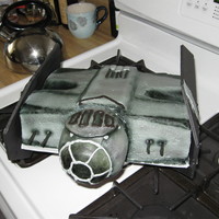 Star Wars Darth Vader 's Tie Fighter Design was copied from an actual toy from toys r us. Vanilla 8x10x2 inch cake is carved and iced in gray vanilla buttercream. Parts of the...