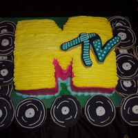 Mtv Cake This was for a 1980's themed party. The "M" is buttercream and the records and "tv" are shortbread cookies...