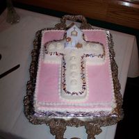 First Communion I made this cake for my daughter's First Communion. It is iced in buttercream with royal roses, and trimmed with edible flowers.