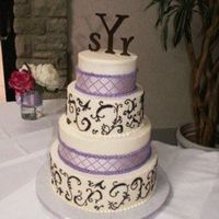 Brown Scrolls, Purple Ribbon 6, 8, 10, 12 rounds iced in buttercream with brown free handed scrolls and purple ribbon. The bride hand painted the monagrams.Thanks for...