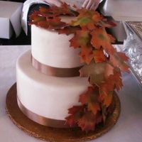 Fall Leaves Dummy My last new dummy for the bridal show. 2 teir stacked covered in ivory fondant with gumpast airbrushed leave and real brown ribbon. Thanks...
