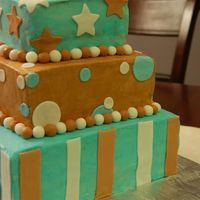 Blue And Brown Baby Shower Cake Buttercream with fondant accents.