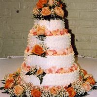 Wedding Cake this is live flowers accept for the petals on the cake and table.