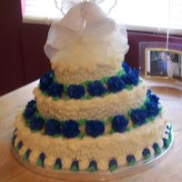 My First Stacked Cake I did this cake for a 25th Anniversary and vow renewal. White cake and everything is in buttercream icing