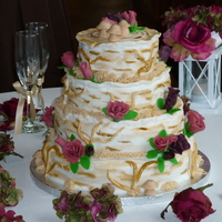 Birch Tree Wedding Cake All tiers are spice cake with a ganache filling. It's covered in fondant, and the flowers are made fom fondant.....I forgot to mention...