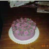 Burgundy Roses This is a white cake, iced in buttercream with buttercream roses. Straight out of a Wilton catalog